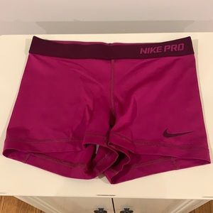 Nike pros. Purplish color. Spandex.